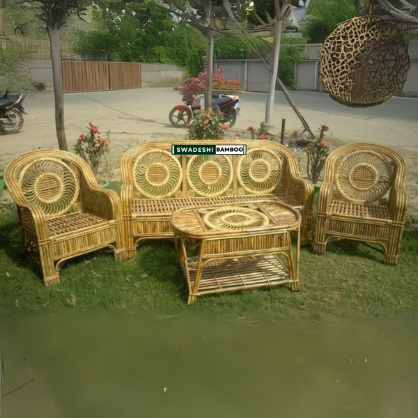 sofa furniture set with a table on a grassy area, featuring 'Swadeshi Bamboo' branding.